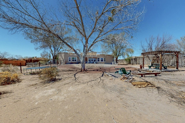 122 Martha Ct, Corrales, NM 87048 - view of yard with a trampoline, a pergola, and fence
