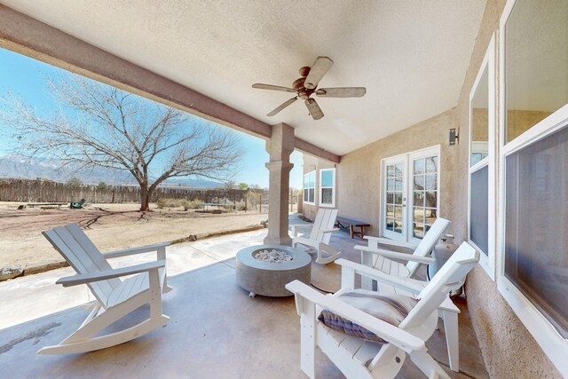 122 Martha Ct, Corrales, NM 87048 - view of patio / terrace with french doors, ceiling fan, a fenced backyard, and a fire pit
