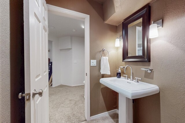 122 Martha Ct, Corrales, NM 87048 - half bathroom with baseboards and a textured wall