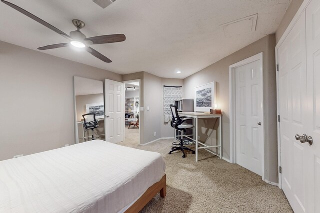 122 Martha Ct, Corrales, NM 87048 - bedroom with visible vents, baseboards, ceiling fan, and light carpet
