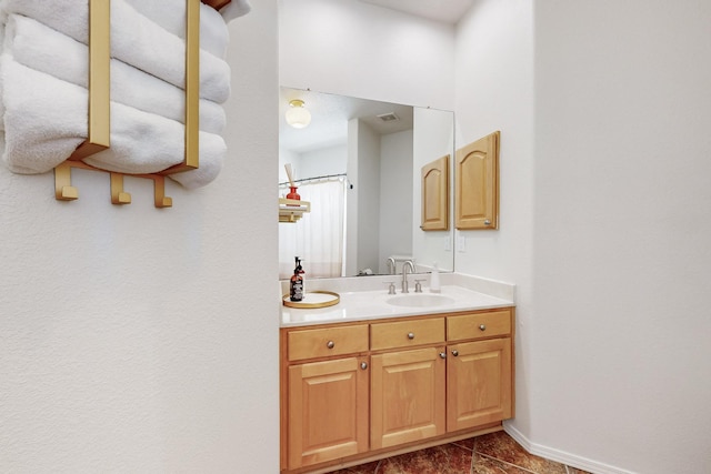 122 Martha Ct, Corrales, NM 87048 - full bathroom with visible vents, baseboards, and vanity