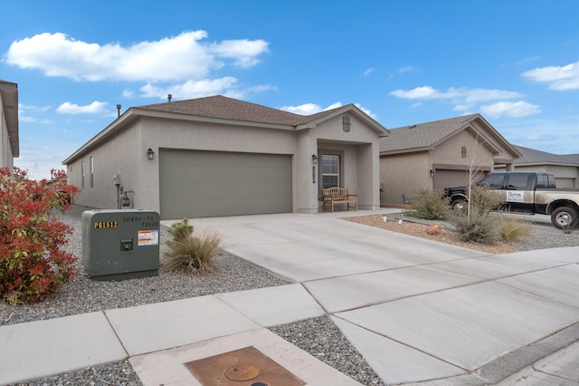 ranch-style house featuring a garage, driveway, and stucco siding