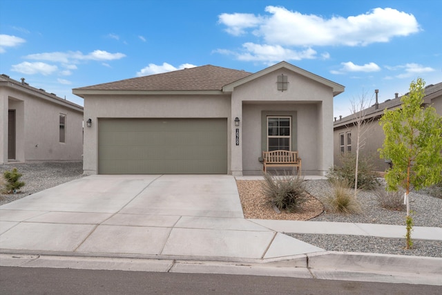 10709 Sabino Loop SW, Albuquerque, NM 87121 - ranch-style home featuring a garage, stucco siding, concrete driveway, and roof with shingles