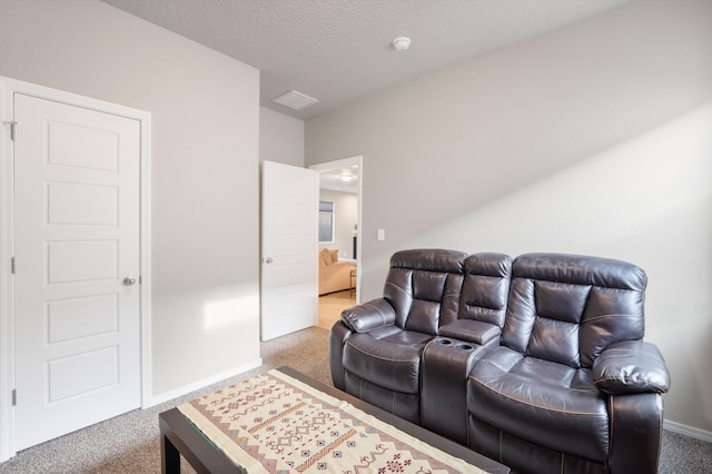 carpeted living room featuring a textured ceiling and baseboards