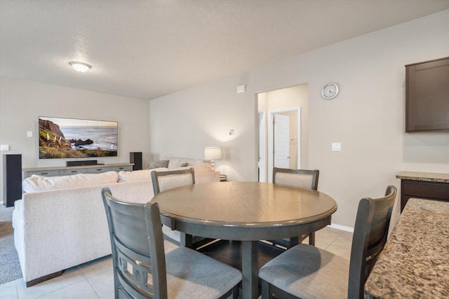 dining area featuring light tile patterned floors