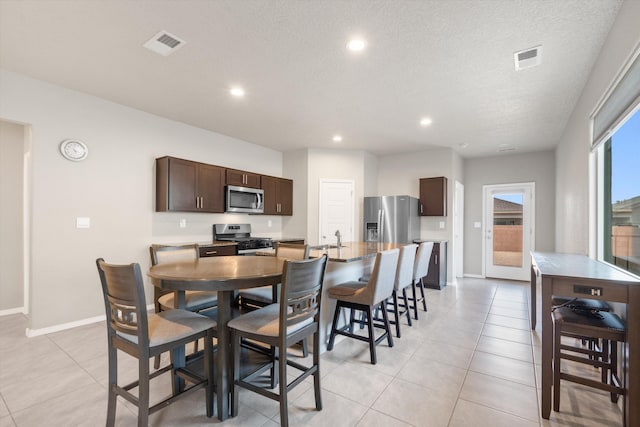 dining space with recessed lighting, visible vents, and light tile patterned floors