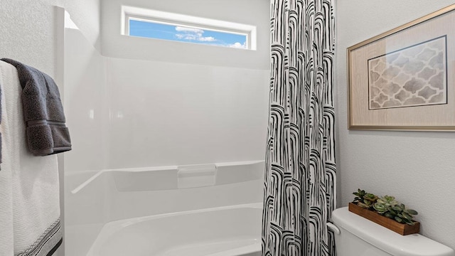 full bathroom with toilet and shower / bath combo