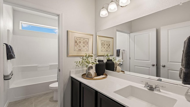 bathroom featuring toilet, tile patterned flooring, and vanity