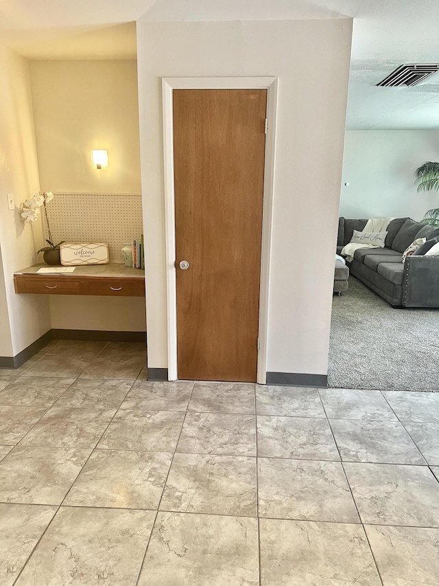 corridor with visible vents and baseboards