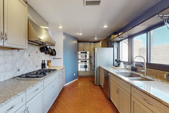 1005 Guadalupe Del Prado St NW, Albuquerque, NM 87107 - kitchen featuring backsplash, visible vents, appliances with stainless steel finishes, a sink, and ventilation hood