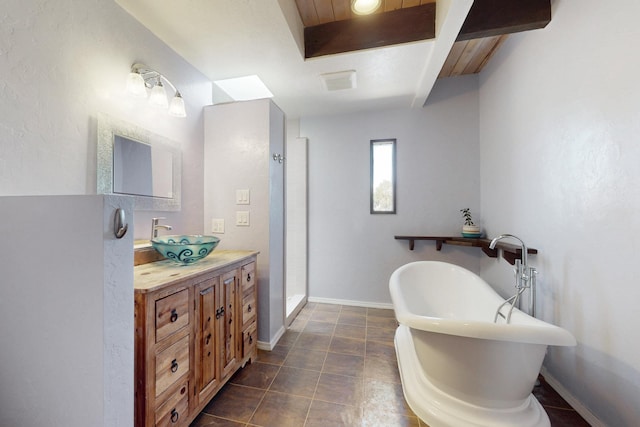1005 Guadalupe Del Prado St NW, Albuquerque, NM 87107 - full bath featuring a stall shower, vanity, baseboards, and a freestanding bath