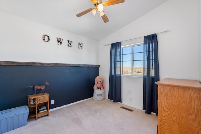 game room featuring baseboards, vaulted ceiling, a ceiling fan, visible vents, and carpet