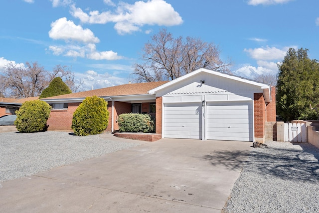 2908 Pennsylvania St NE, Albuquerque, NM 87110 - single story home with brick siding, an attached garage, and driveway