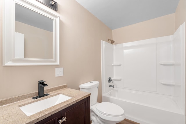 bathroom with  shower combination, vanity, and toilet