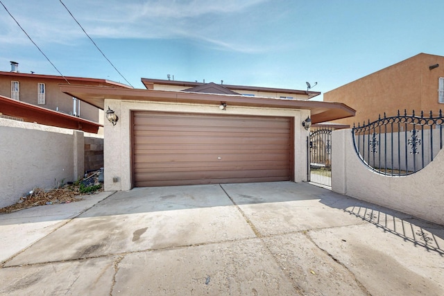 3008 Corona Dr NW, Albuquerque, NM 87120 - view of front of house with a gate, a garage, fence, concrete driveway, and stucco siding