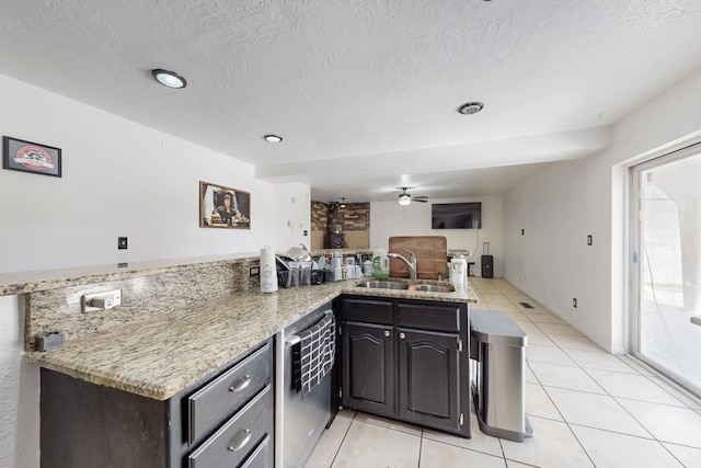 3008 Corona Dr NW, Albuquerque, NM 87120 - kitchen with a ceiling fan, light stone countertops, dishwasher, a sink, and light tile patterned flooring