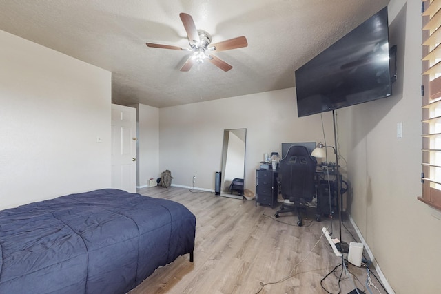 3008 Corona Dr NW, Albuquerque, NM 87120 - bedroom with baseboards, a ceiling fan, a textured ceiling, and wood finished floors
