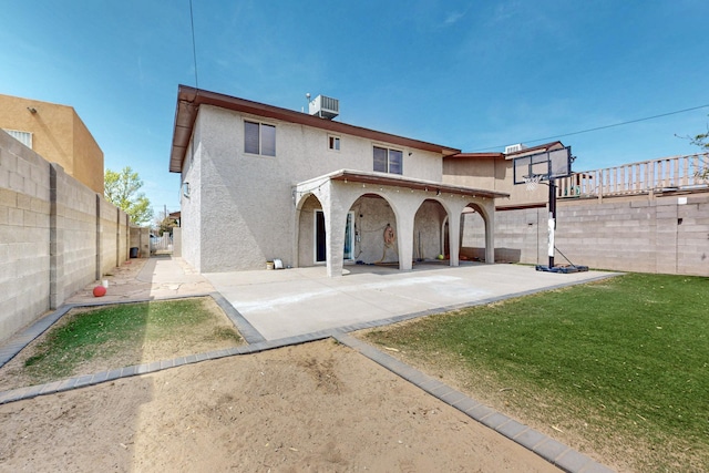 3008 Corona Dr NW, Albuquerque, NM 87120 - rear view of property featuring a patio, a fenced backyard, stucco siding, central AC unit, and a lawn