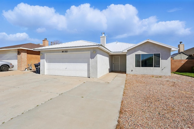 6901 Verano Ct NW, Albuquerque, NM 87120 - ranch-style home with a chimney, a garage, driveway, stucco siding, and metal roof
