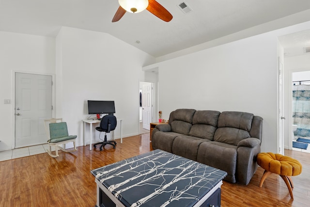 6901 Verano Ct NW, Albuquerque, NM 87120 - living room featuring a ceiling fan, lofted ceiling, wood finished floors, baseboards, and a desk