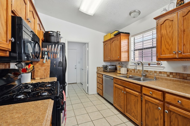 6901 Verano Ct NW, Albuquerque, NM 87120 - kitchen with black appliances, a sink, lofted ceiling, light tile patterned floors, and light countertops