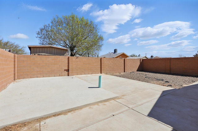 6901 Verano Ct NW, Albuquerque, NM 87120 - fenced backyard with a patio area