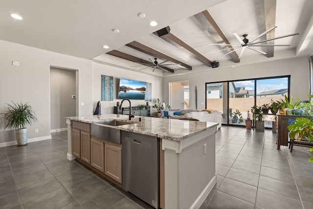 kitchen with open floor plan, dark tile patterned flooring, stainless steel dishwasher, and ceiling fan