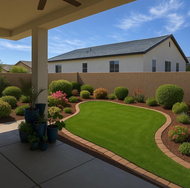 view of yard featuring a ceiling fan, a patio, and fence