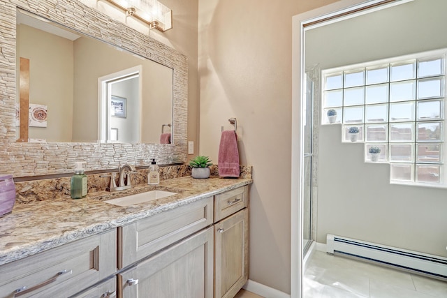 bathroom featuring vanity, a stall shower, and a baseboard radiator