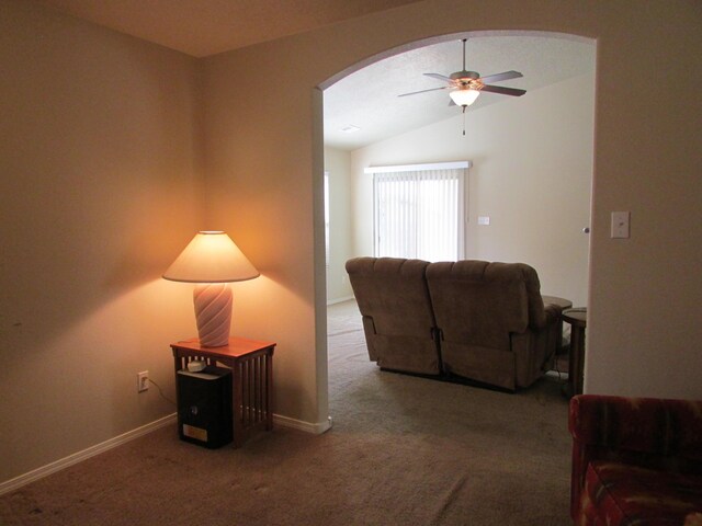 2843 Violeta Cir SE, Rio Rancho, NM 87124 - carpeted living area with vaulted ceiling, baseboards, arched walkways, and ceiling fan
