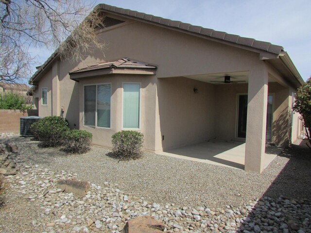2843 Violeta Cir SE, Rio Rancho, NM 87124 - rear view of property with central air condition unit, a ceiling fan, a patio, and stucco siding