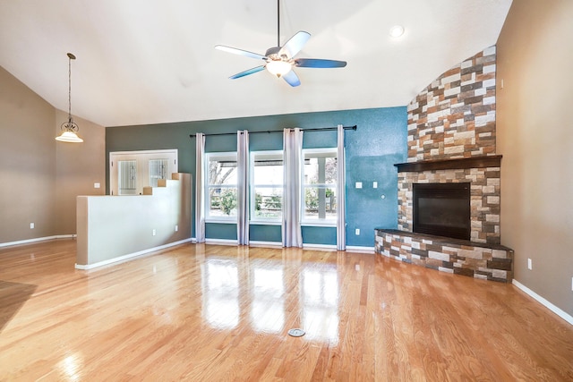 2703 Pueblo Grande Trl NW, Albuquerque, NM 87120 - unfurnished living room featuring baseboards, high vaulted ceiling, wood finished floors, and ceiling fan