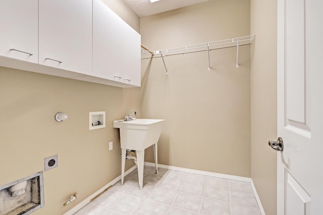 2703 Pueblo Grande Trl NW, Albuquerque, NM 87120 - laundry area with hookup for an electric dryer, cabinet space, hookup for a washing machine, baseboards, and gas dryer hookup