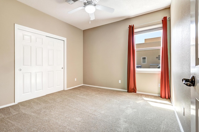 2703 Pueblo Grande Trl NW, Albuquerque, NM 87120 - unfurnished bedroom featuring ceiling fan, a closet, carpet flooring, and baseboards