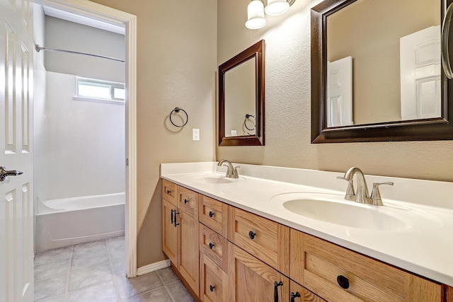 2703 Pueblo Grande Trl NW, Albuquerque, NM 87120 - full bathroom with shower / bathing tub combination, tile patterned flooring, double vanity, and a sink