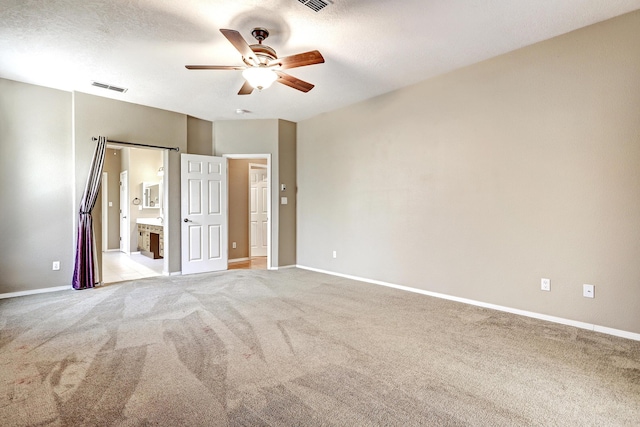 2703 Pueblo Grande Trl NW, Albuquerque, NM 87120 - unfurnished bedroom featuring light carpet, ensuite bathroom, visible vents, and baseboards