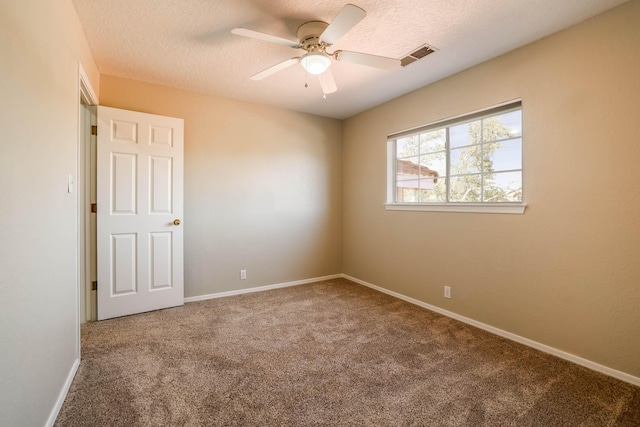 4804 Mesa Terraza Pl NW, Albuquerque, NM 87120 - empty room featuring carpet flooring, a textured ceiling, and a ceiling fan
