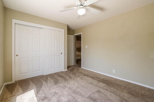 4804 Mesa Terraza Pl NW, Albuquerque, NM 87120 - unfurnished bedroom with carpet, a closet, and a ceiling fan