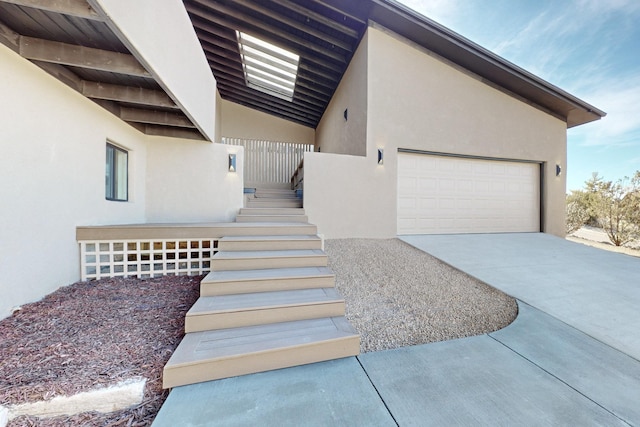 4500 Skyline Ct NE, Albuquerque, NM 87111 - property entrance with stucco siding and driveway