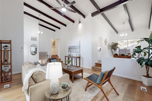 4500 Skyline Ct NE, Albuquerque, NM 87111 - living area with a chandelier, light wood-style flooring, high vaulted ceiling, ceiling fan, and stairs
