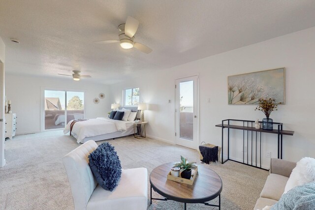 4500 Skyline Ct NE, Albuquerque, NM 87111 - bedroom with access to exterior, light colored carpet, and ceiling fan