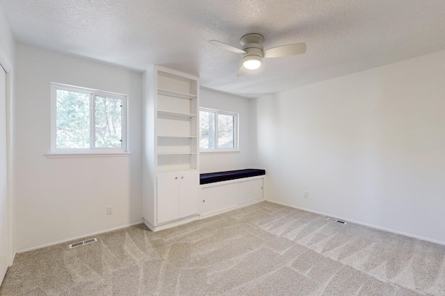 4500 Skyline Ct NE, Albuquerque, NM 87111 - spare room with ceiling fan, light colored carpet, and a textured ceiling