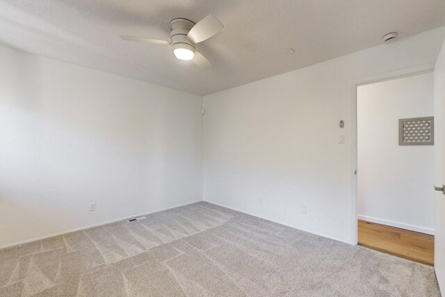 4500 Skyline Ct NE, Albuquerque, NM 87111 - empty room with carpet flooring, a ceiling fan, and a smoke detector