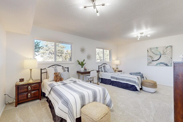 4500 Skyline Ct NE, Albuquerque, NM 87111 - carpeted bedroom with a textured ceiling