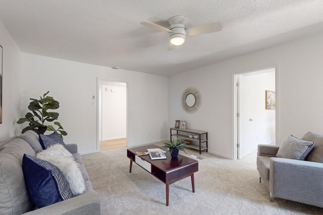 4500 Skyline Ct NE, Albuquerque, NM 87111 - living area featuring ceiling fan, light carpet, and a textured ceiling