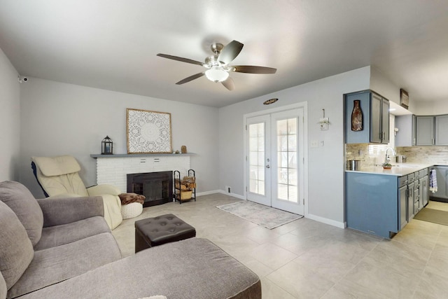 3501 Westerfeld Dr NE, Albuquerque, NM 87111 - living area with ceiling fan, light tile patterned floors, a brick fireplace, french doors, and baseboards