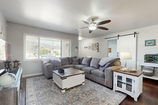 3501 Westerfeld Dr NE, Albuquerque, NM 87111 - living area featuring ceiling fan, a barn door, baseboards, and dark wood-style floors
