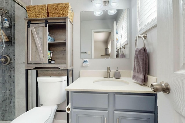 3501 Westerfeld Dr NE, Albuquerque, NM 87111 - bathroom featuring tiled shower, vanity, and toilet