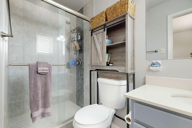 3501 Westerfeld Dr NE, Albuquerque, NM 87111 - bathroom with a shower stall, vanity, and toilet