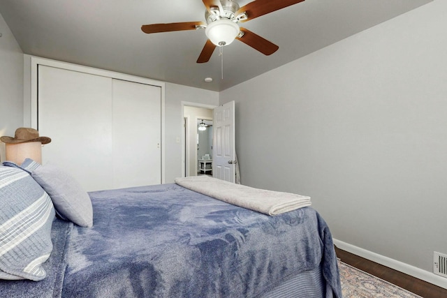 3501 Westerfeld Dr NE, Albuquerque, NM 87111 - bedroom featuring dark wood-type flooring, a closet, baseboards, and a ceiling fan